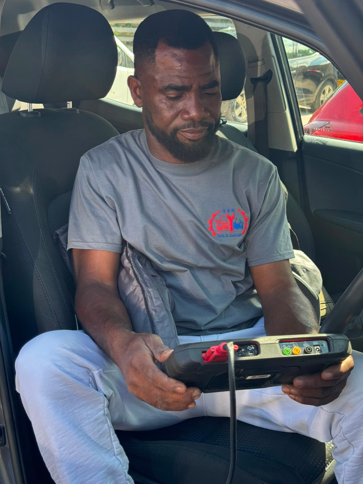 Professional Mechanic Diagnosing Engine